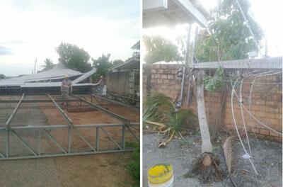 Partes do teto de uma obra arrancado pelo vento atingiram duas residências e três postes de energia (Foto: Divulgação)