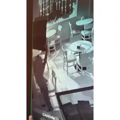 Câmeras do local flagraram momento em que bandido leva televisor de confeitaria (Foto: Divulgação)